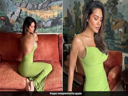 Even With An Exquisite Painting Behind Her, It's Hard To Take Our Eyes Away From Esha Gupta In A Green Backless Gown Even With An Exquisite Painting Behind Her, It's Hard To Take Our Eyes Away From Esha Gupta In A Green Backless Gown