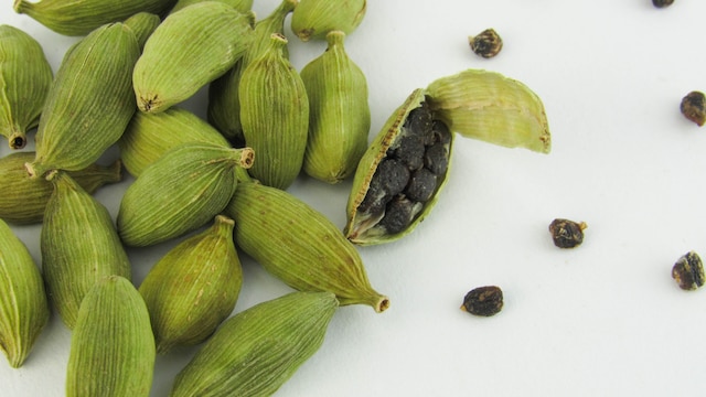 Crush a few cardamom pods, boil them with water, and steep to make cardamon tea