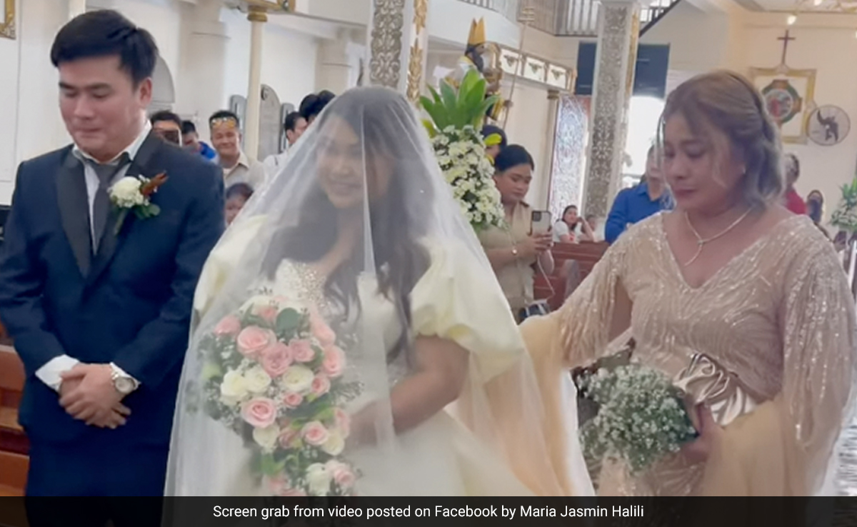 Watch: Bride Walks Down Flooded Aisle After Typhoon Doksuri In Philippines