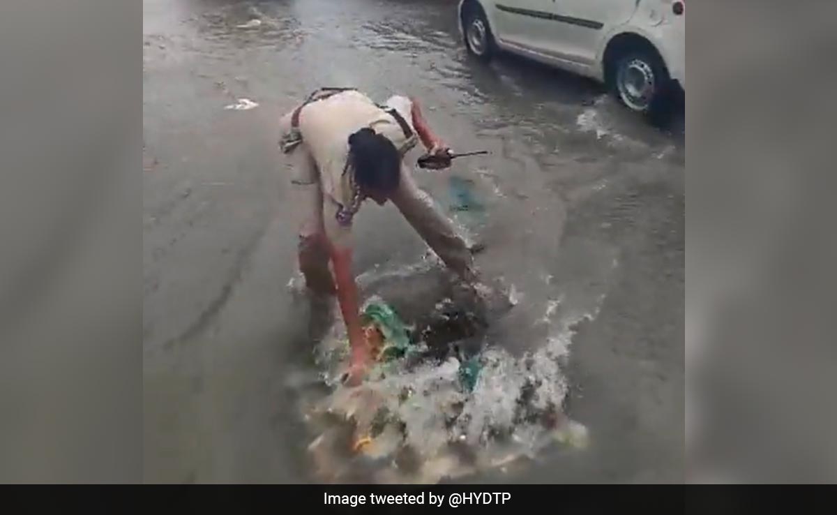 Watch: Woman Cop Cleans Clogged Drain With Hand To Clear Waterlogging In Hyderabad
