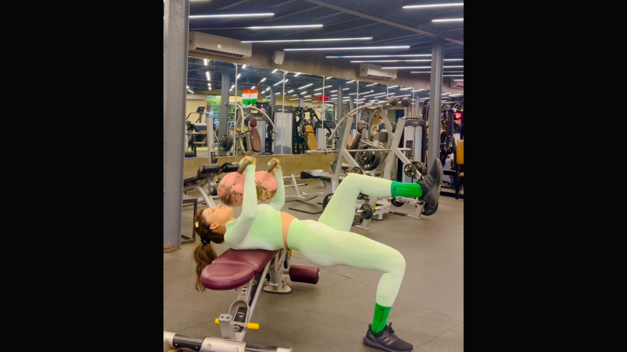 Urvashi Rautela's "Single Arm Kettlebell Press" In A Mint Green Set Is 90 x The Monday Fitness Inspiration We Need