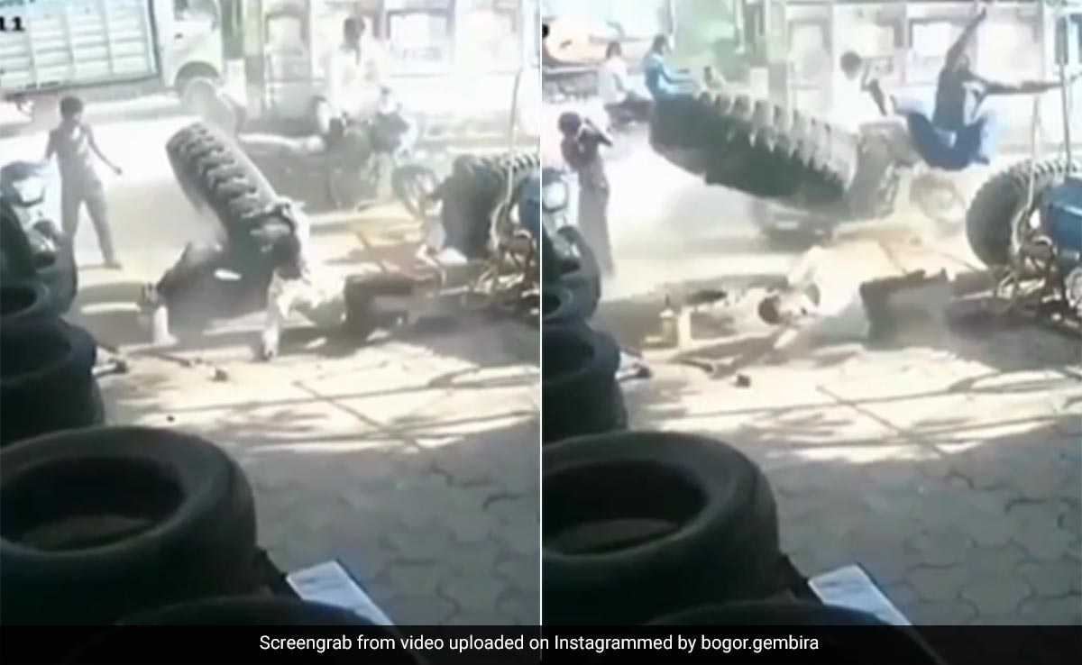 ट्रक के टायर का पंचर बनाते हुए अचानक ट्यूब में हुआ धमाका, तीन लोग हवा में उड़ गए, बार-बार Video देख रहे लोग