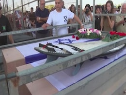 Israel Boy Buried Beside Mother With Surfboard. Father Lost Legs In Attack Israel Boy Buried Beside Mother With Surfboard. Father Lost Legs In Attack