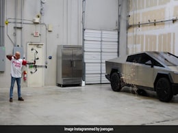 Watch: Elon Musk Enjoys Cigar As Joe Rogan Fires Arrow At Tesla Cybertruck To Test Its Toughness Watch: Elon Musk Enjoys Cigar As Joe Rogan Fires Arrow At Tesla Cybertruck To Test Its Toughness