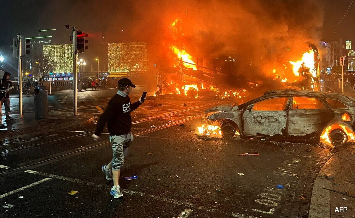 Flames rise from a car and a bus, set alight at the junction of Bachelors Walk and the OConnell Bridge. Flames rise from a car and a bus, set alight at the junction of Bachelors Walk and the OConnell Bridge.