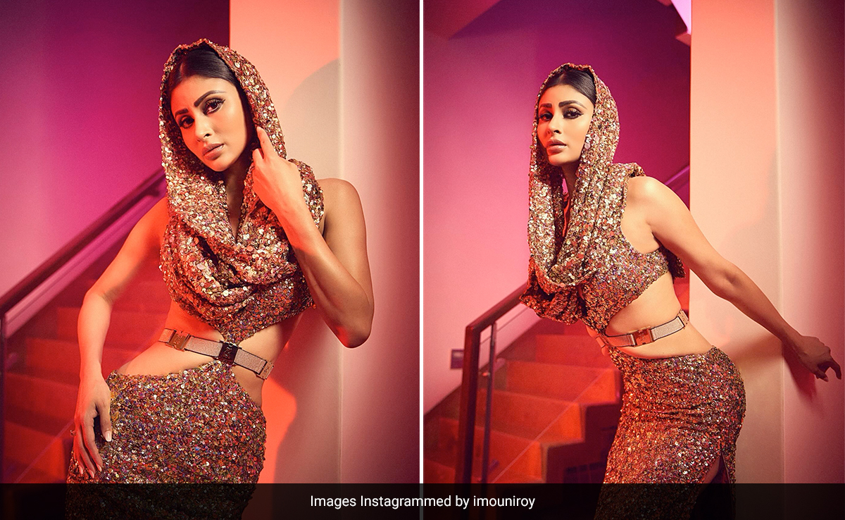 Mouni Roy's Golden Hooded Cutout Gown With A Belt Sparkles Like A Sky Lit Up With Fireworks