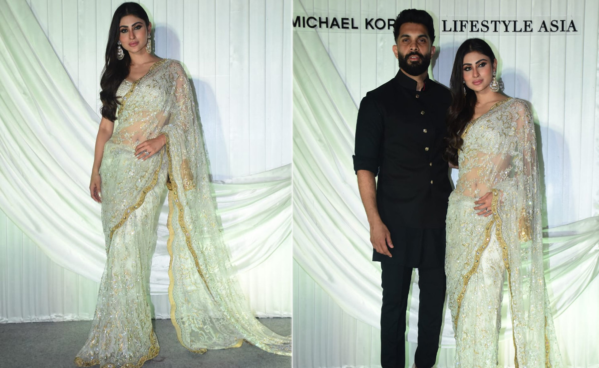 Mouni Roy Stays True To Being A "<i>Saree</i> Girl Forever" In A White Lace <i>Saree</i> With Husband Suraj Nambiar By Her Side