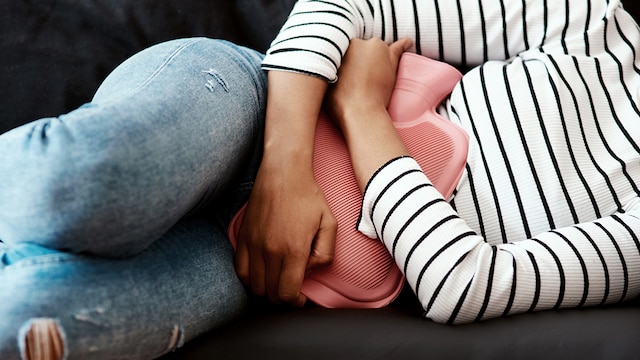 Fluid-filled sacs on the ovaries can lead to sharp or aching pelvic pain during menstruation