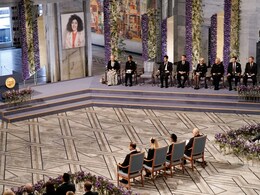 Jailed Iranian Activist's Children Accept Nobel, Chair Kept Empty For Her Jailed Iranian Activist's Children Accept Nobel, Chair Kept Empty For Her
