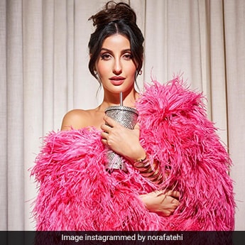nora fatehi pink dress Looks Like The Candy Store Went To Nora Fatehi In A Feathery Pink Gown  Instead For Lifestyle Asia