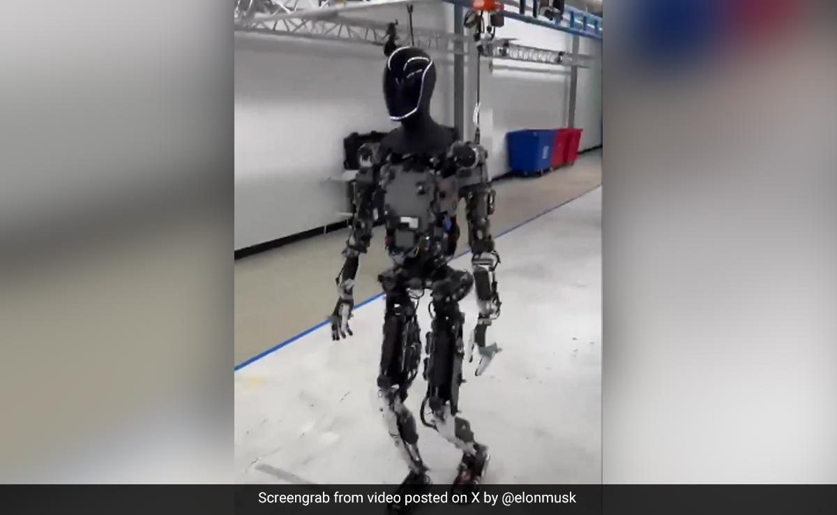 Video: Tesla's Optimus Robot Goes For A Walk With Elon Musk