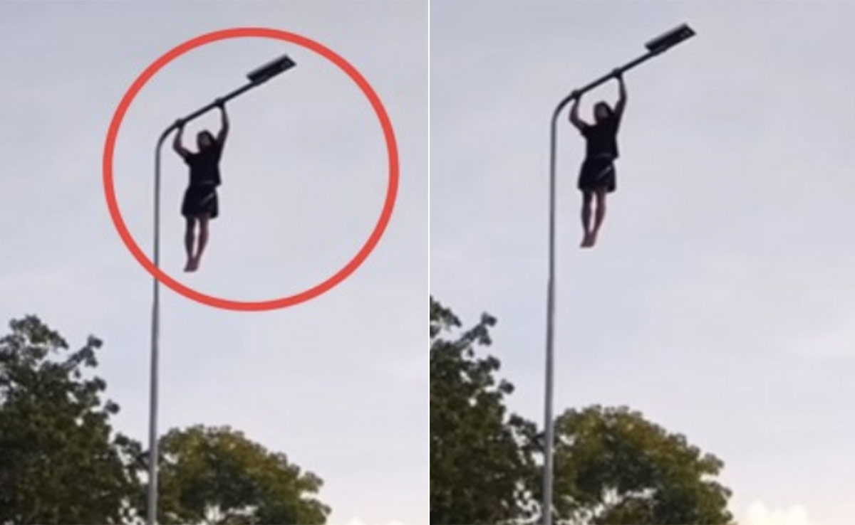 पुश अप्स लगाने के लिए स्ट्रीट लैंप पर चढ़ गया शख्स, वीडियो देख लोगों ने पकड़ा माथा