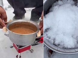 बर्फीली नदी पर बैठकर शख्स ने बर्फ से ही बना दी चाय, 7 करोड़ से भी ज्यादा लोगों ने देखा Video