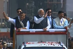 PM Modi Waves At Supporters During Mega Roadshow In Assam PM Modi Waves At Supporters During Mega Roadshow In Assam