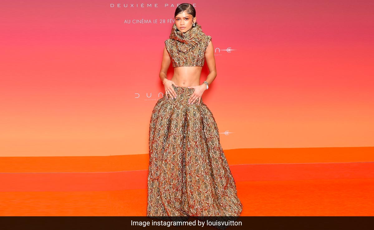 Zendaya Takes Her Method Dressing Game To Paris In Gold Louis Vuitton Co-Ords For <i>Dune 2</i> Promotions