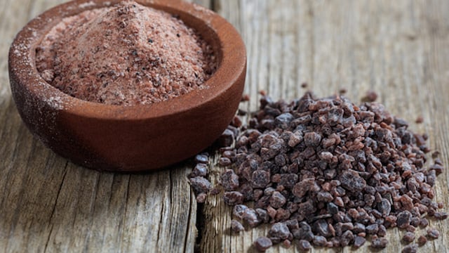 The nutritionist mentions that black salt has a lower sodium content than regular table salt