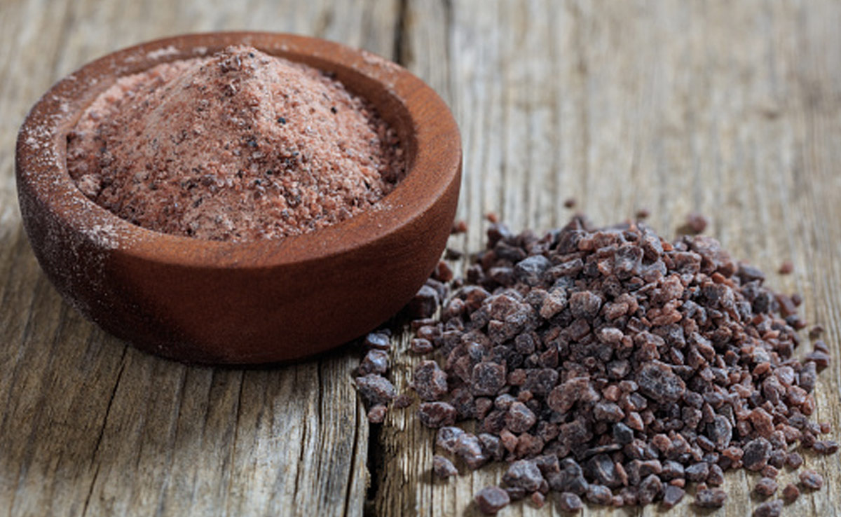 The nutritionist mentions that black salt has a lower sodium content than regular table salt