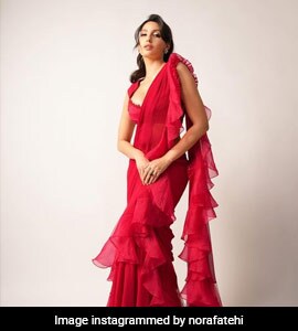 nora fatehi red dress photo Short form fitted Red dress. Nora Fatehi