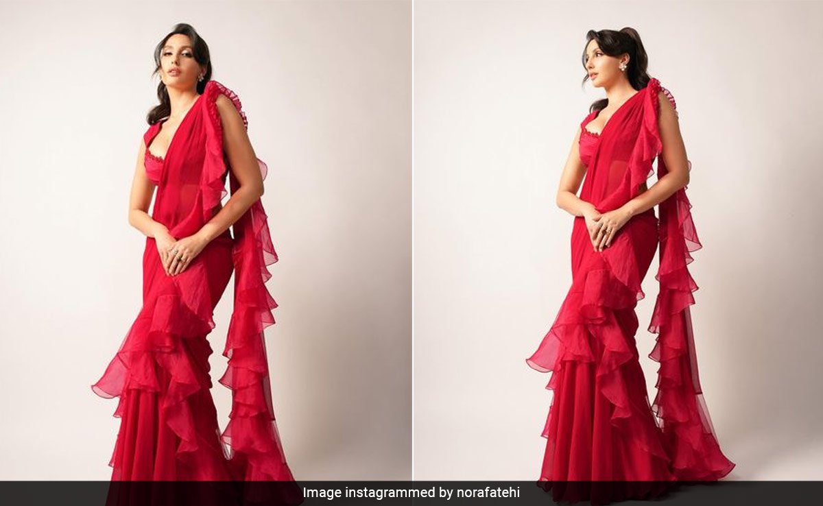 We're Experiencing A Heat Wave This Spring And Nora Fatehi In A Stunning Red Ridhi Mehra Ruffled <i>Saree</i> Is Why