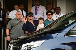 Priyanka Spotted At The Airport With Husband And Daughter Priyanka Spotted At The Airport With Husband And Daughter