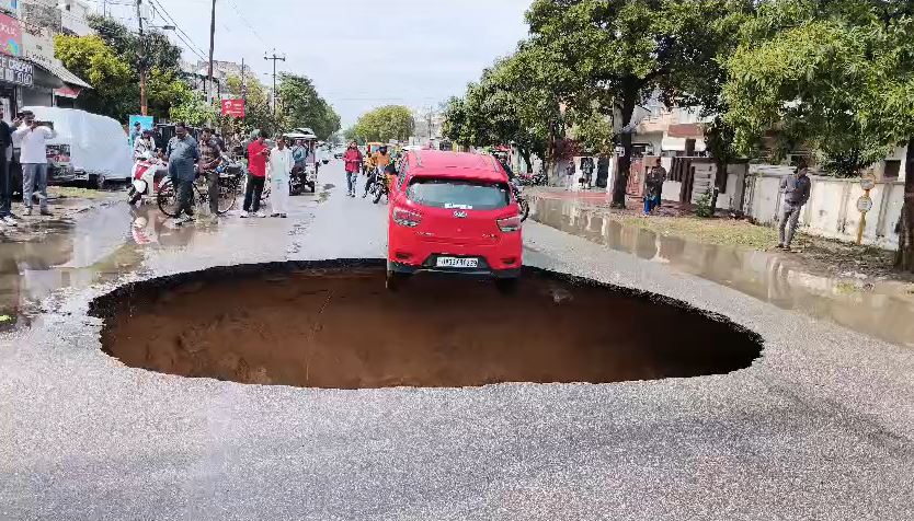 Car Almost Falls Into Giant Crater After Lucknow Road Caves In Car Almost Falls Into Giant Crater After Lucknow Road Caves In