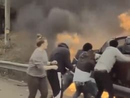 Watch: Dramatic Rescue Of Man Stuck In Burning Car On US Highway