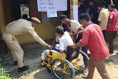 Voter Turnout In Assam's Nagaon: Women With Umbrellas, People In Wheelchairs Voter Turnout In Assam's Nagaon: Women With Umbrellas, People In Wheelchairs