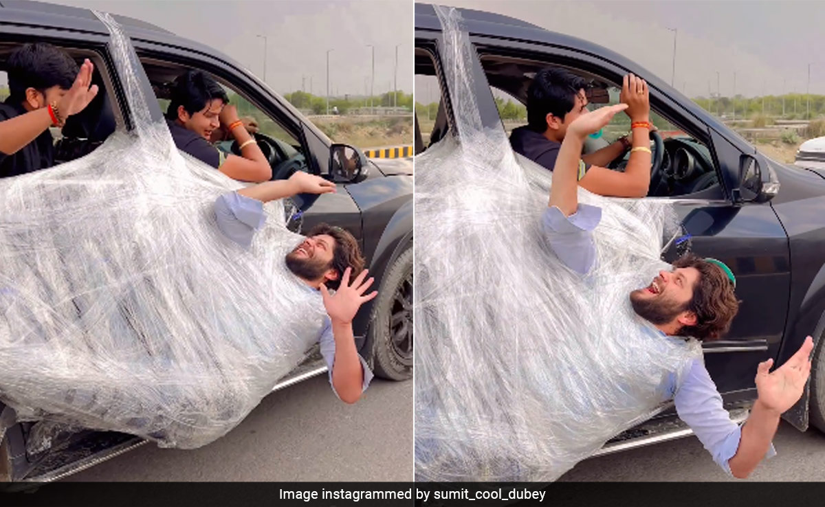 Man Hangs From Moving Car's Door With Plastic Wrap, Video Has 92 Million Views