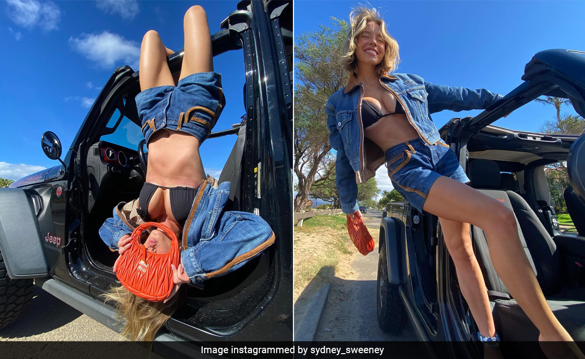 Sydney Sweeney In A Black Swim Top, Denim Shorts And A Miu Miu Handbag Make For The Chicest Hawaiian Summer