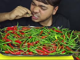Watch: Delhi Food Vlogger Takes Spice Challenge To Another Level, Eats Plate Full Of Raw Chillies