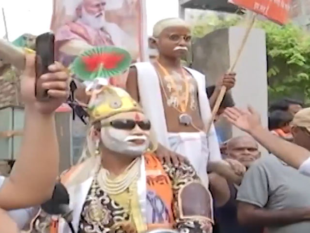 Man On Bike Impersonating PM Modi With Gandhi On His Back Seat