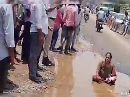 Woman's Unique Protest To Flag Poor Condition Of Roads In Hyderabad Woman's Unique Protest To Flag Poor Condition Of Roads In Hyderabad