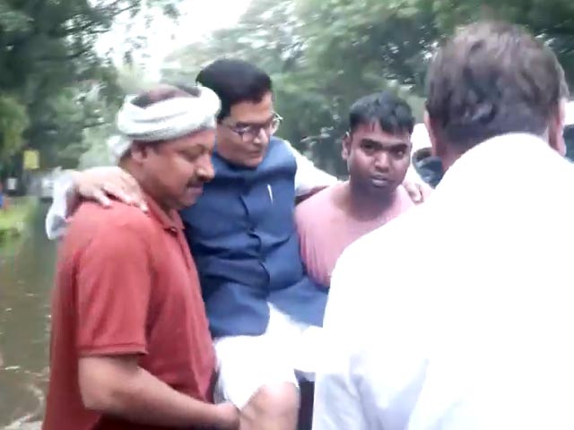 Watch: Samajwadi Party MP Carried To Car By Staff On Waterlogged Road