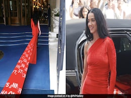 Katy Perry's Red Dress Had A Train Printed With <i>Woman's World</i> Song Lyrics That Spoke Volumes About Her Dramatic Style Katy Perry's Red Dress Had A Train Printed With <i>Woman's World</i> Song Lyrics That Spoke Volumes About Her Dramatic Style