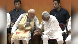 Nitish Kumar Grabs PM's Inked Finger At Nalanda Opening, Video Is Viral