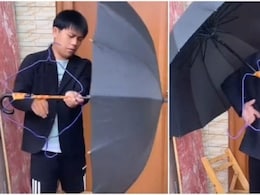 Viral Video : सोशल मीडिया पर वायरल हुआ हैंड फ्री छाता ! आनंद महिंद्रा ने शेयर कर लिखी ये बात...