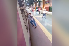Man Performs Stunt While Boarding Local Train In Mumbai Man Performs Stunt While Boarding Local Train In Mumbai