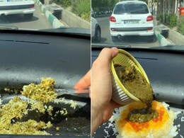 कार के डैशबोर्ड पर परोसा खाना और चम्मच से उठाकर खाने लगा शख्स, Video देख आग बबूला हुए लोग, बोले- भाई को प्लेट दे दो कोई