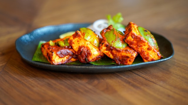 "Tandoori" varieties of food (especially outside) are often drenched in oil