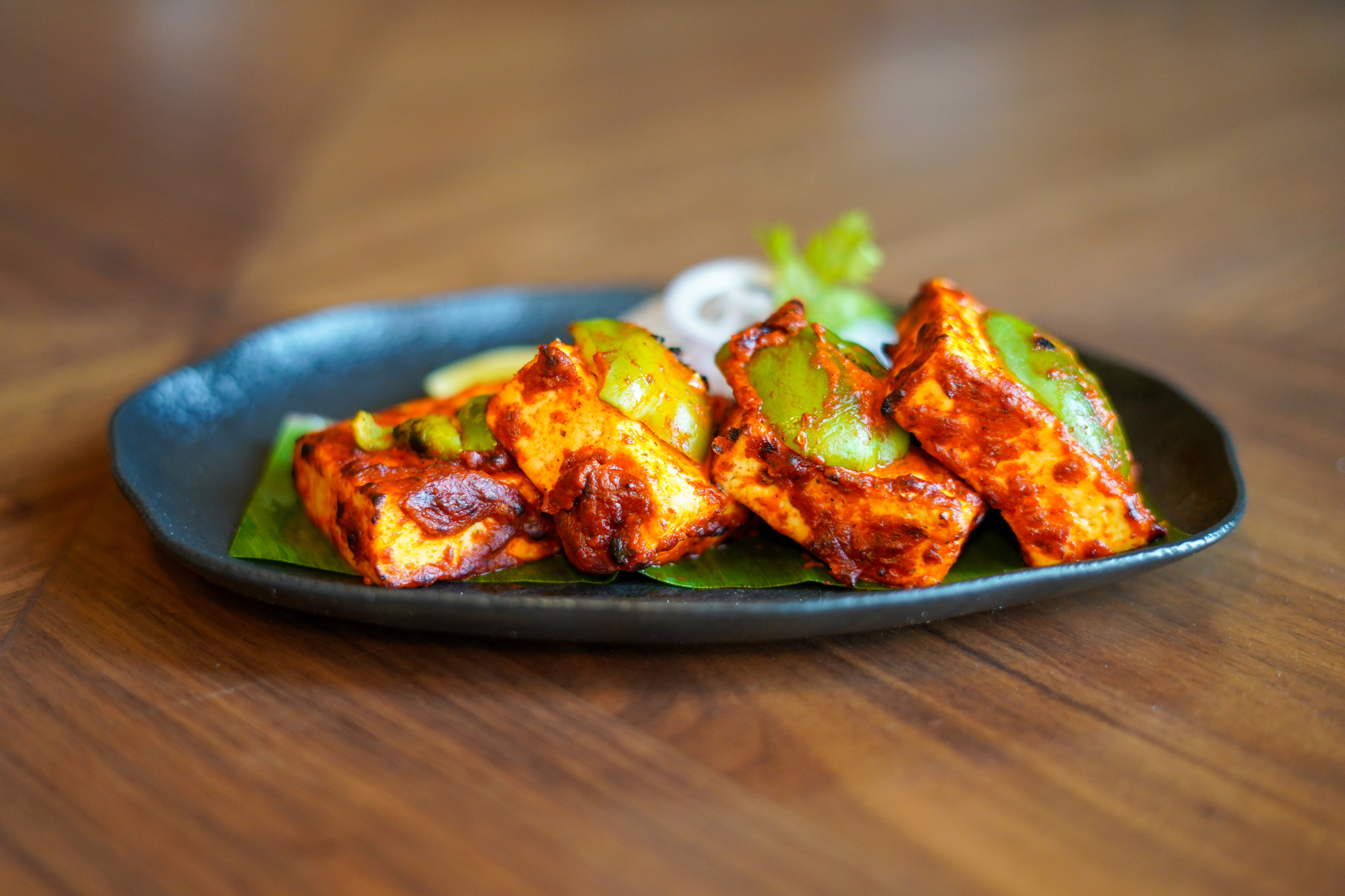 "Tandoori" varieties of food (especially outside) are often drenched in oil