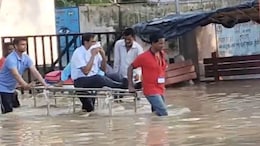 Video: With Road Flooded, Medical College Principal Taken Out On A Stretcher