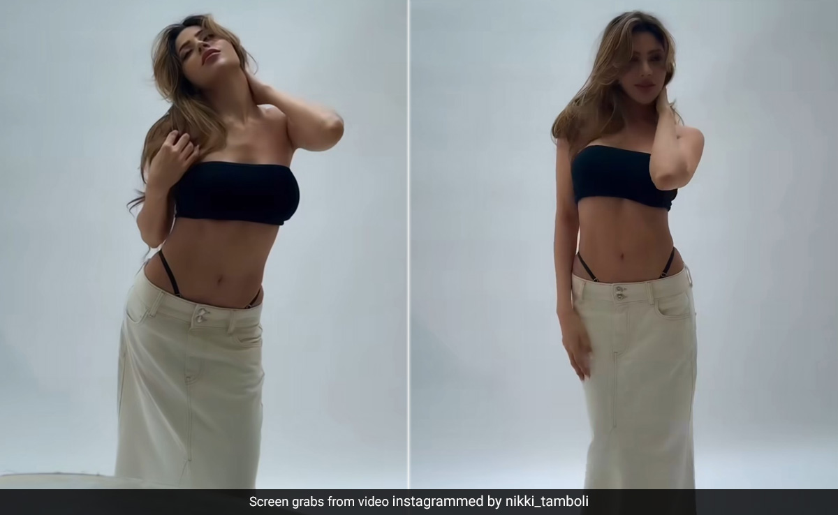Nikki Tamboli Is "Bringing The Heat" To Our Weekend In A Black Swim Set And White Skirt