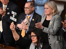 US Lawmaker Hold Ups "War Criminal" Sign During Netanyahu's Congress Speech US Lawmaker Hold Ups "War Criminal" Sign During Netanyahu's Congress Speech