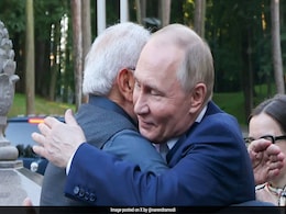 PM Modi Hugs Putin On Russia Visit, Tea Meet At His Home, Golf Cart Ride PM Modi Hugs Putin On Russia Visit, Tea Meet At His Home, Golf Cart Ride
