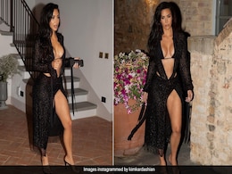 When Kim Kardashian "Entered The Villa" She Stole The Show In This Black Swim Set Dress Combo When Kim Kardashian "Entered The Villa" She Stole The Show In This Black Swim Set Dress Combo