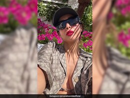 Malaika Arora Can't Go Wrong With A Red Lip And A Monogram Gucci Holiday Shirt And Bralette In Spain Malaika Arora Can't Go Wrong With A Red Lip And A Monogram Gucci Holiday Shirt And Bralette In Spain