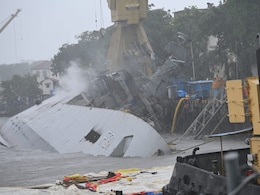 INS Brahmaputra Severely Damaged In Fire, Lying On Its Side; Sailor Missing INS Brahmaputra Severely Damaged In Fire, Lying On Its Side; Sailor Missing