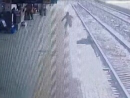Video: Woman Hit By Train While Crossing Railway Tracks On Platform, Saved By Cop Video: Woman Hit By Train While Crossing Railway Tracks On Platform, Saved By Cop