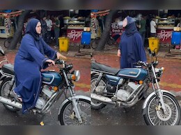 बारिश में भीगी सड़कों पर बुर्का बाइक राइडर का दबंग स्टाइल हुआ वायरल, देख लोग बोले- हिजाबी क्वीन