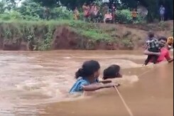 Villagers Use The Support Of A Rope To Cross A River Due To Flood Situation In Odisha Villagers Use The Support Of A Rope To Cross A River Due To Flood Situation In Odisha